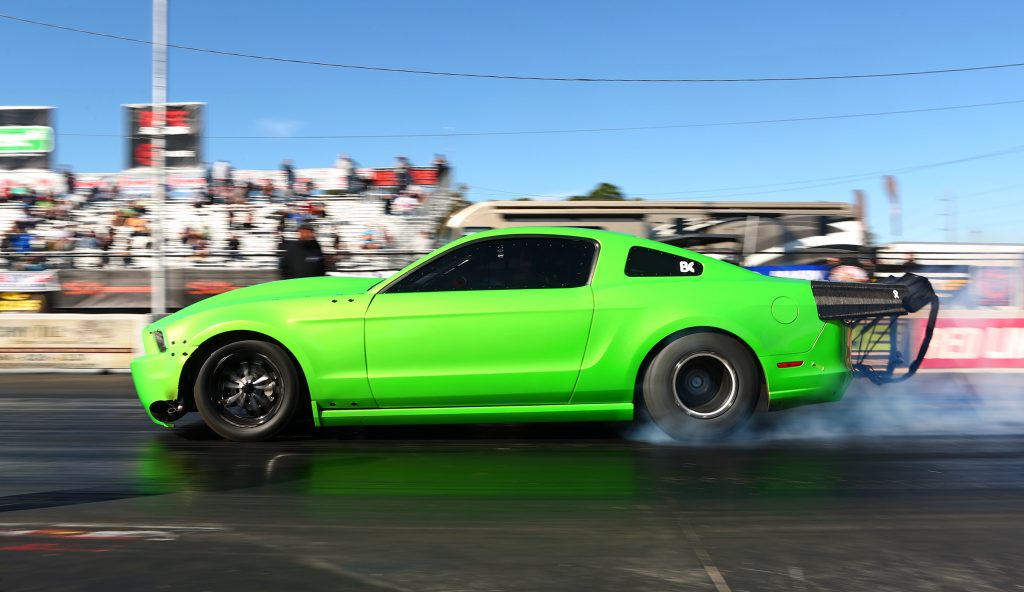 s197 green mustang on dragstrip