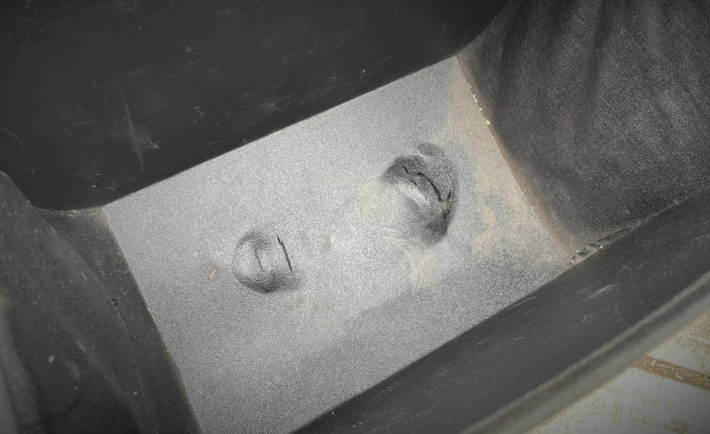 melted floor of a soft motorcycle saddlebag