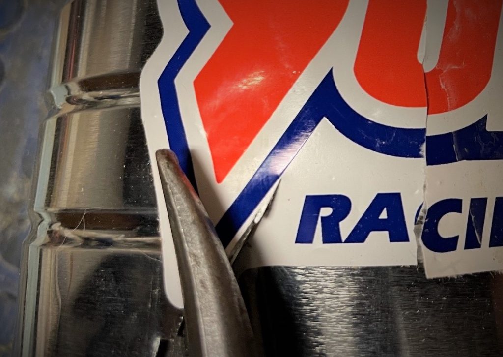 close up of tin snip cutting metal coffee can