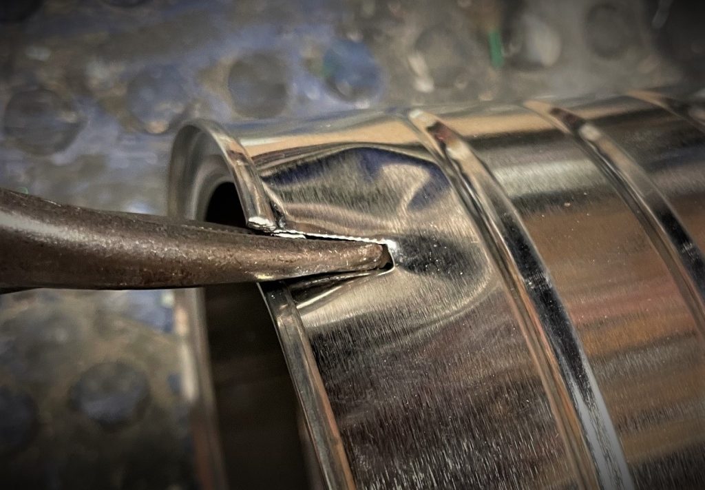 tin snip cutting through a coffee can