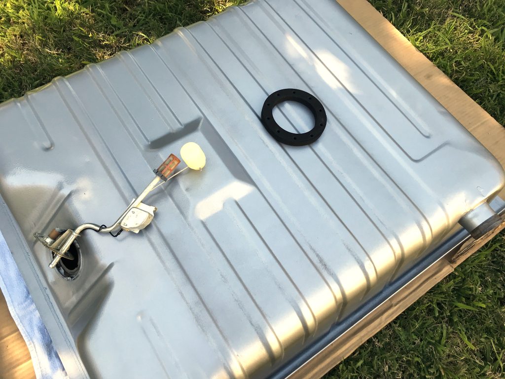 circular gasket resting on a fuel tank with sender