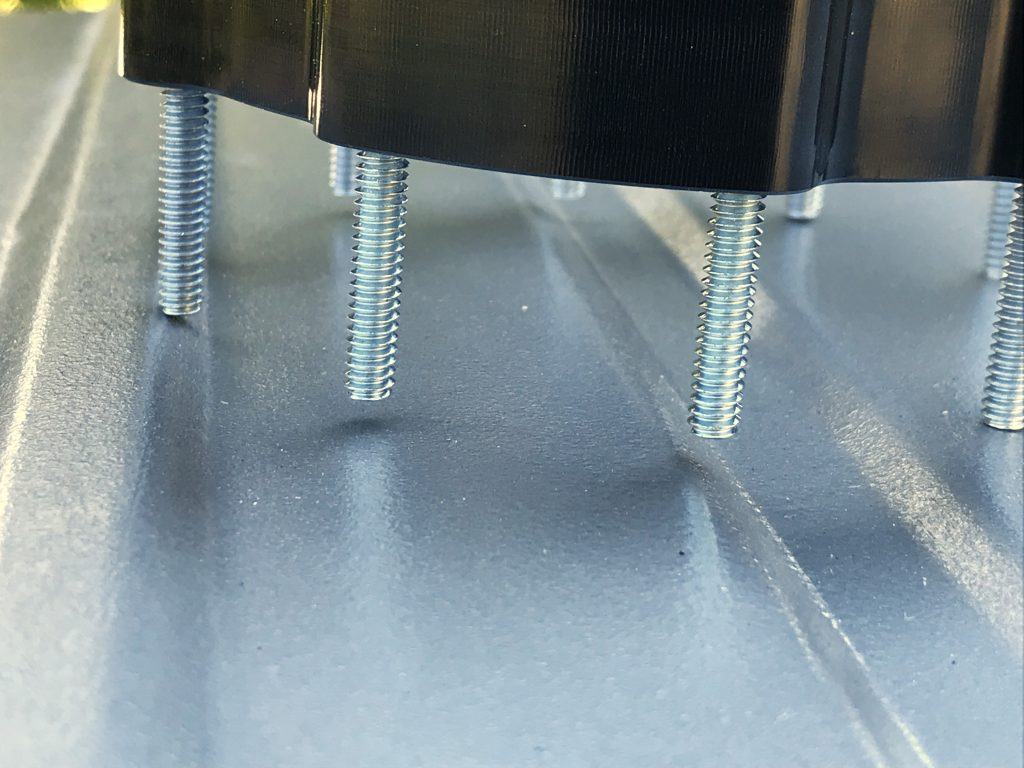 close up of mounting bolts for in tank fuel pump bracket