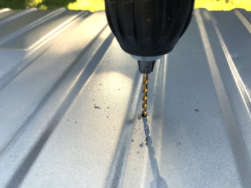 drilling pilot hole in fuel tank for hole saw