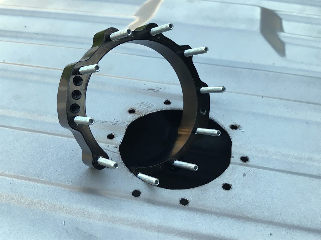 backside pump mounting bracket inserted into a fuel tank