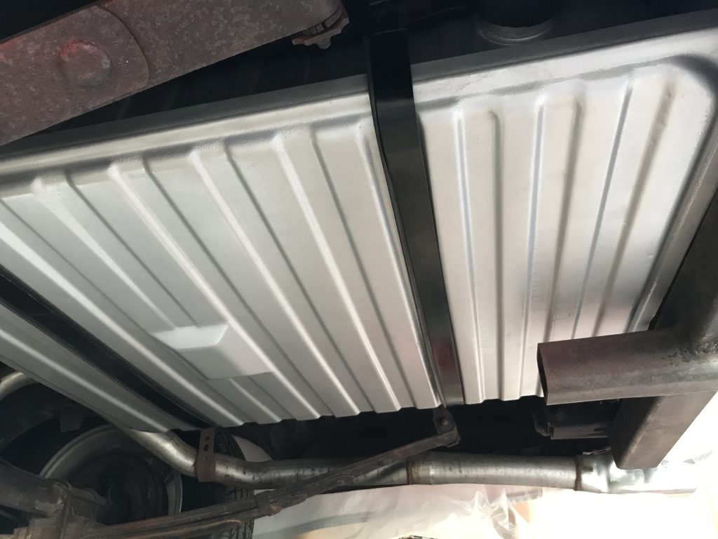 new fuel tank installed under a vintage vehicle