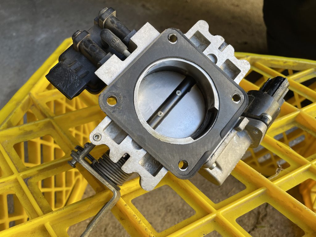 view of butterfly on a Jeep Cherokee xj 4.0L throttle body