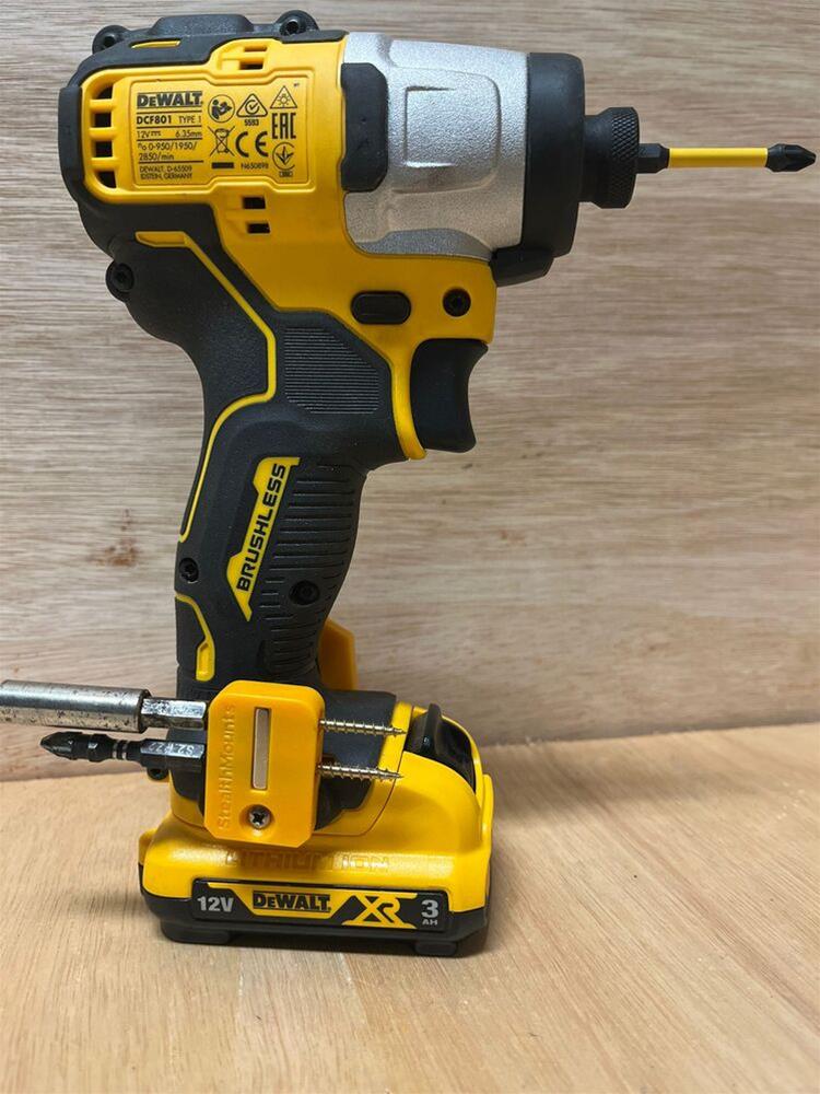 dewalt power tool with bits mounted to battery