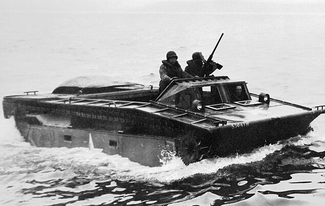 vintage photo of a LVT Water Buffalo beginning a beach landing