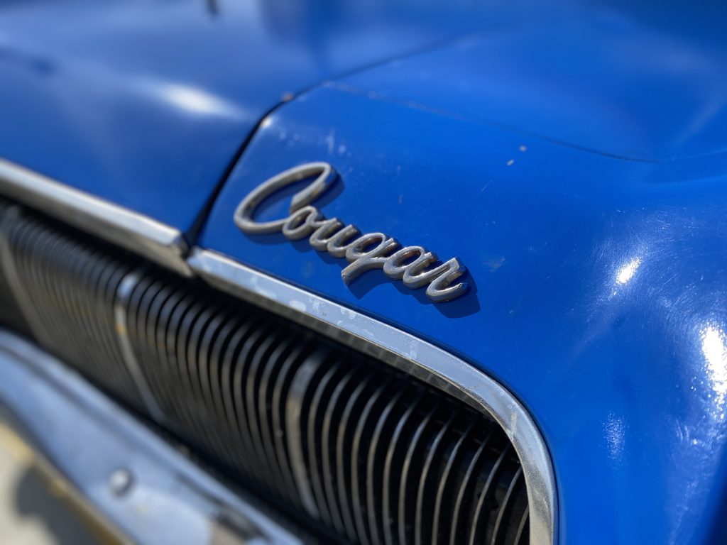 close up of a mercury cougar hood emblem