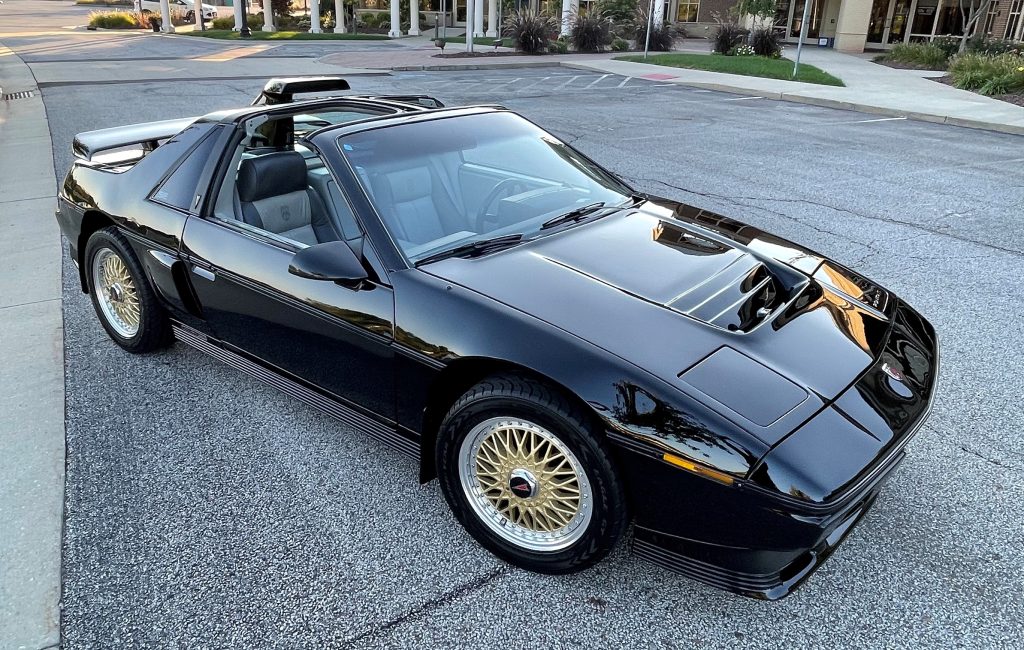 Black Pontiac Fiero Show car in parking lot
